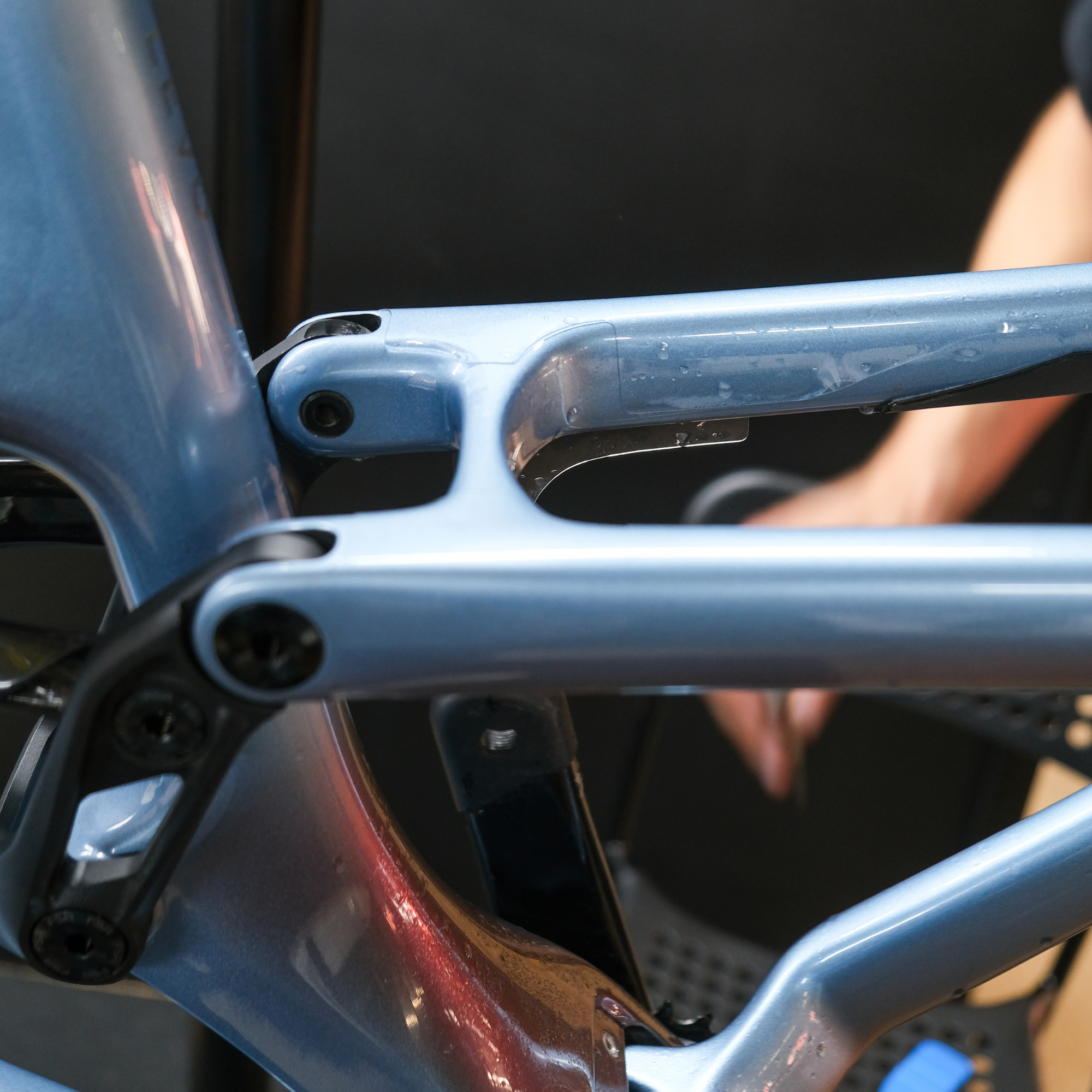 Detailed close-up of Ride Wrap frame protection that is being applied to a bike frame.