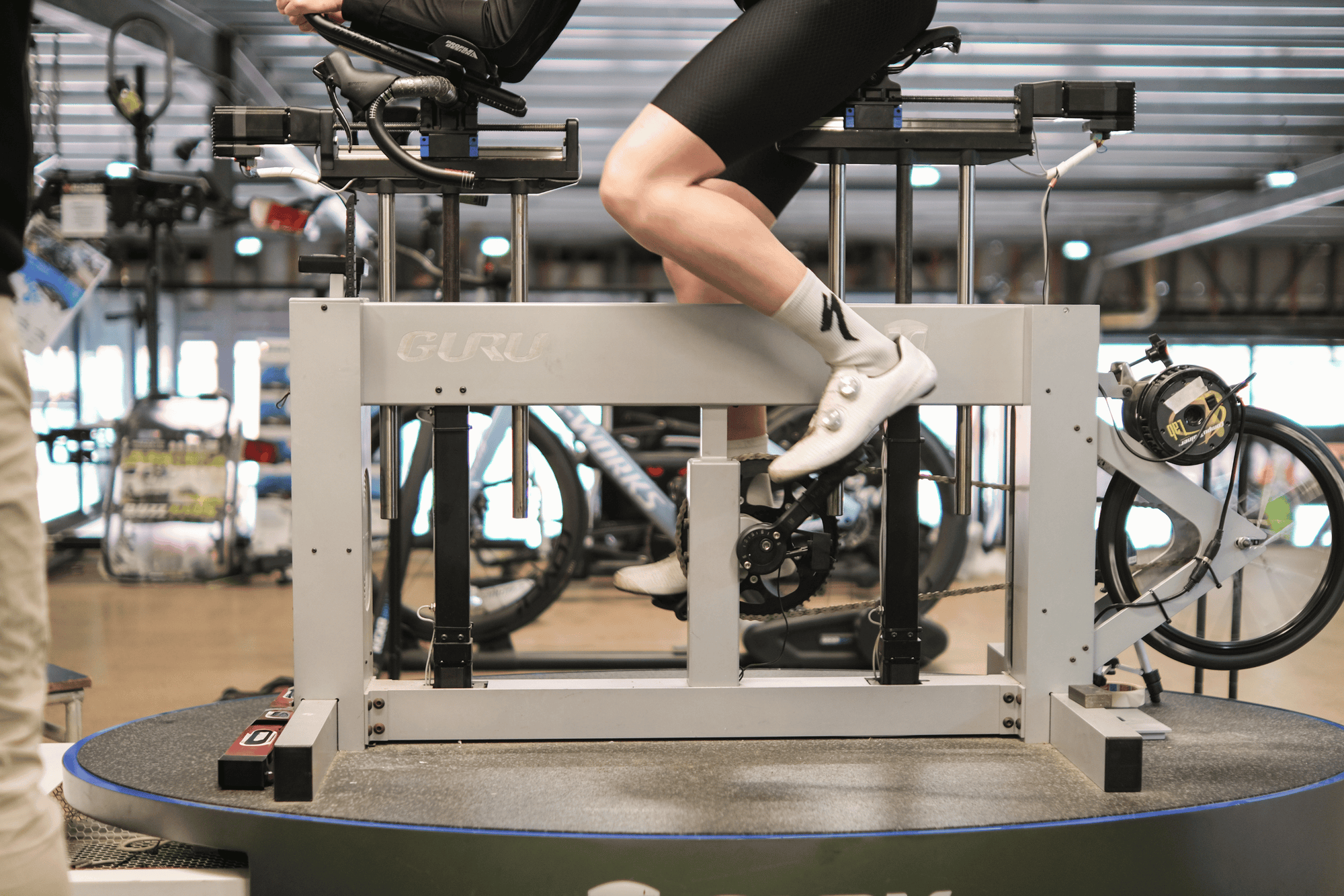 Person using the Guru bike fitting machine in a TT position. 